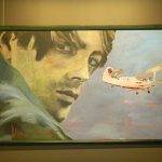 Painting of man and airplane